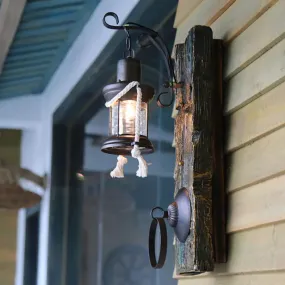 Coastal Black Kerosene Sconce with Clear Glass Bulb and Wooden Backplate for Outdoor Lighting