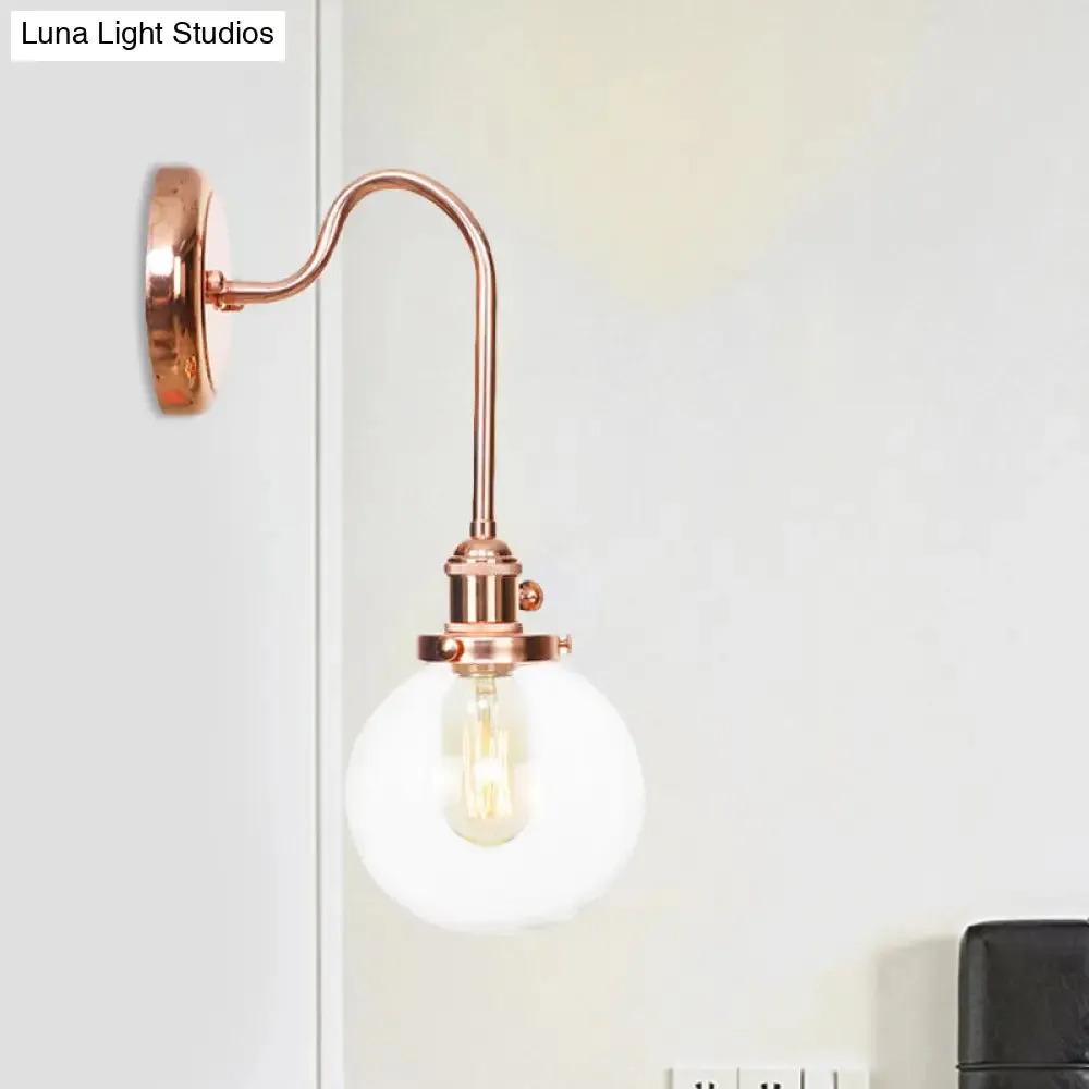 Copper Vintage Globe Wall Sconce with Curved Arm and Clear/Amber Glass - 1 Light