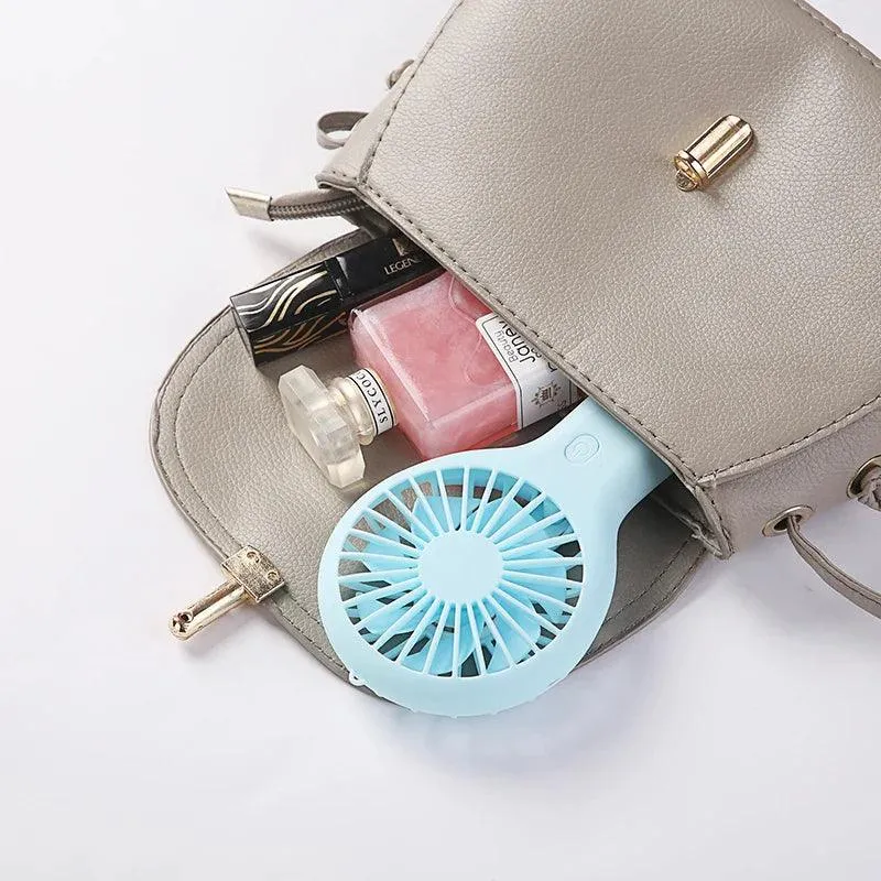 Mini Handheld Small Fan: Portable Cooling Companion with Quiet Operation