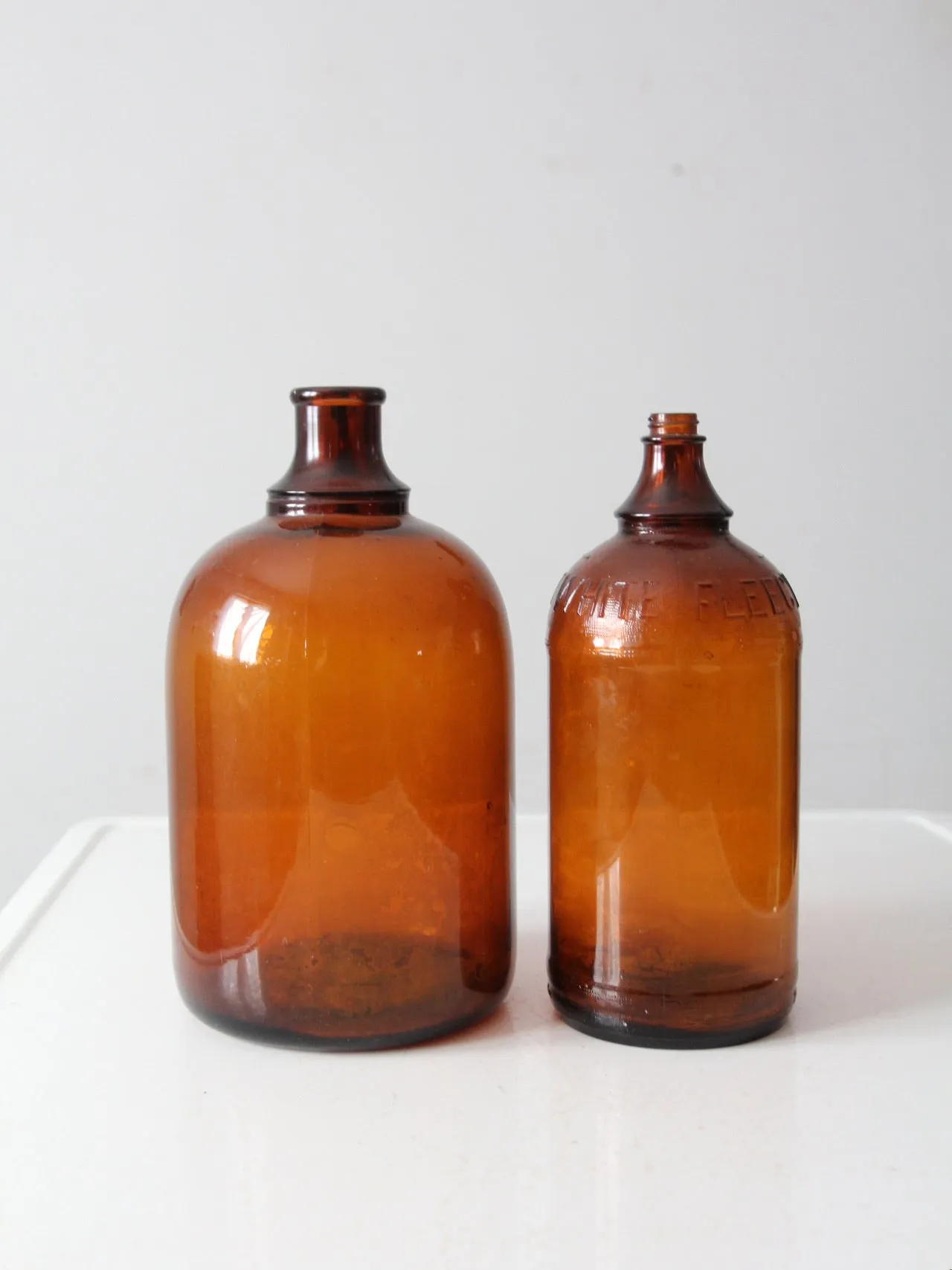 vintage brown glass bottle jugs pair