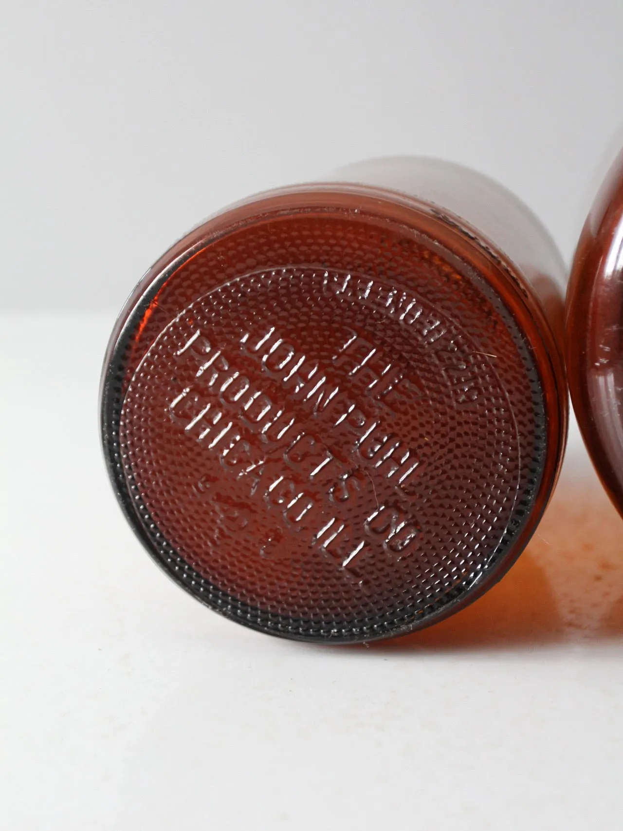 vintage brown glass bottle jugs pair